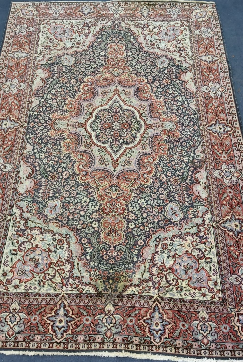 A Turkish Tabriz carpet, 312 x 201cm